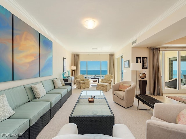 carpeted living room featuring a water view and crown molding