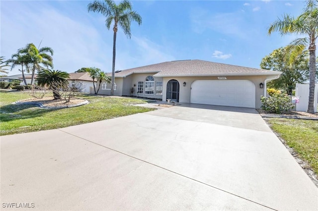 ranch-style house with a garage and a front lawn