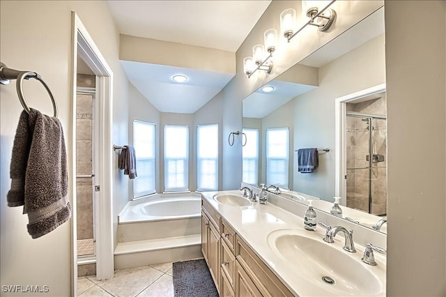 bathroom featuring vanity, tile patterned floors, and shower with separate bathtub