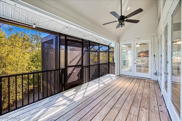 unfurnished sunroom with lofted ceiling, french doors, and ceiling fan