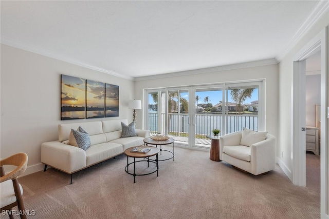 living room with light carpet, ornamental molding, and a water view