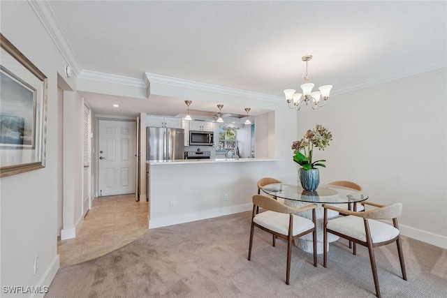 dining area with an inviting chandelier, sink, ornamental molding, and light colored carpet