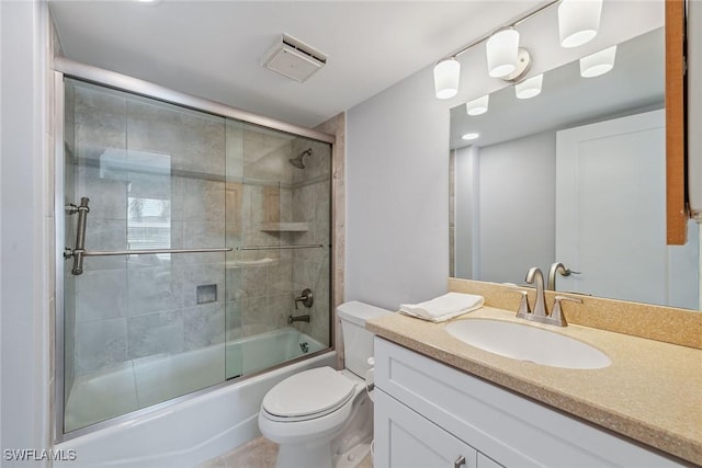 full bathroom with vanity, shower / bath combination with glass door, and toilet