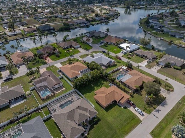 birds eye view of property with a water view