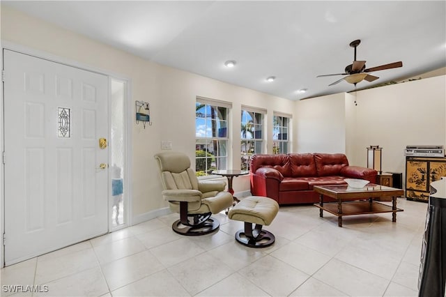 tiled living room with ceiling fan