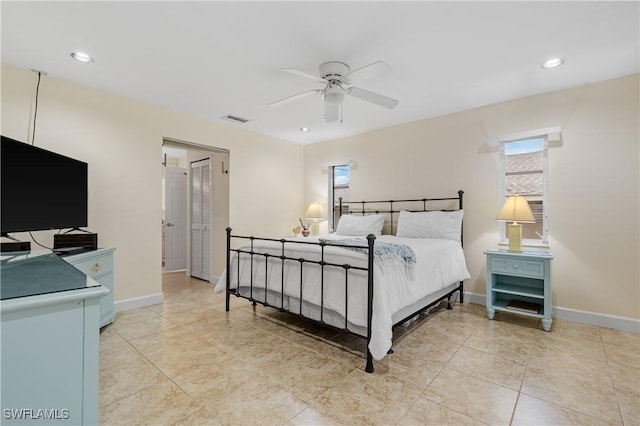 tiled bedroom with ceiling fan