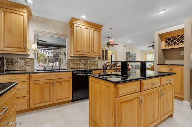 kitchen featuring ceiling fan, dishwasher, sink, and a center island with sink