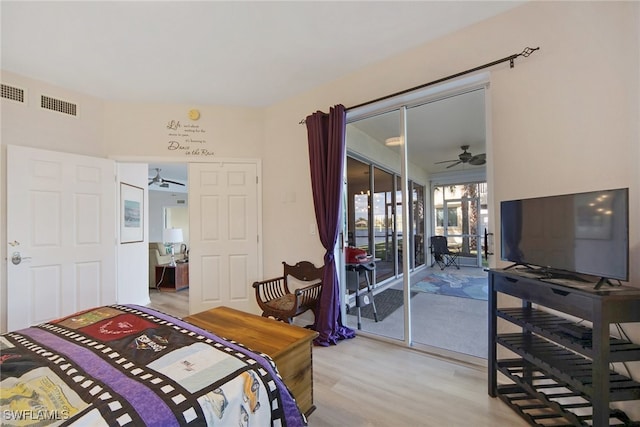 bedroom featuring light hardwood / wood-style floors and access to outside