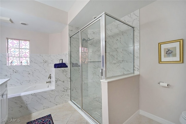 bathroom with a bath, tile patterned floors, vanity, and a marble finish shower