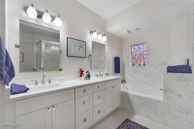 bathroom featuring separate shower and tub, vanity, and tile patterned flooring