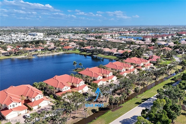 drone / aerial view featuring a water view and a residential view