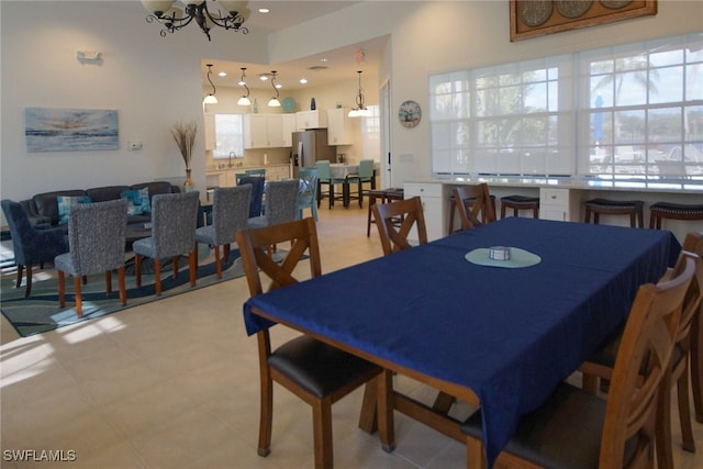 dining room with sink and a chandelier