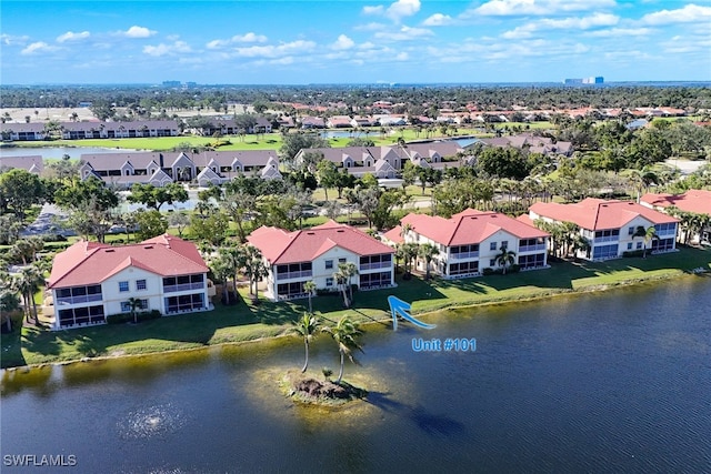 drone / aerial view with a water view and a residential view