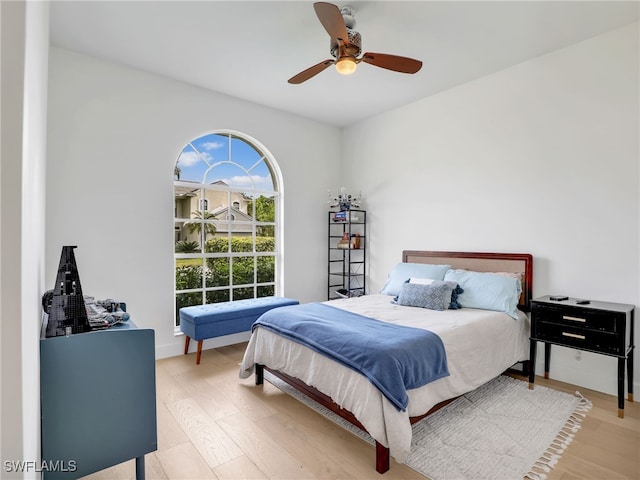 8850 Springwood Ct, Bonita Springs, FL 34135 - bedroom featuring a ceiling fan and light wood finished floors