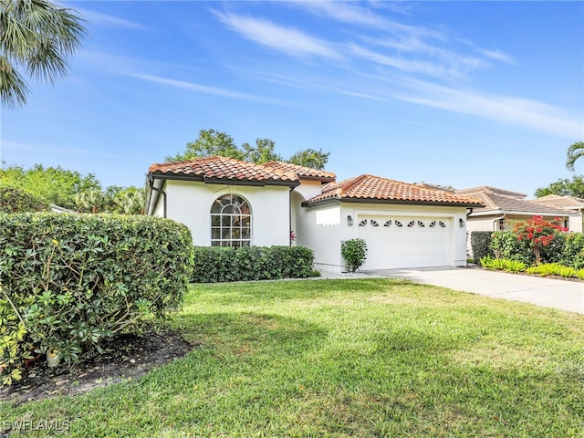 8850 Springwood Ct, Bonita Springs, FL 34135 - mediterranean / spanish home featuring concrete driveway, stucco siding, a tiled roof, a front lawn, and a garage
