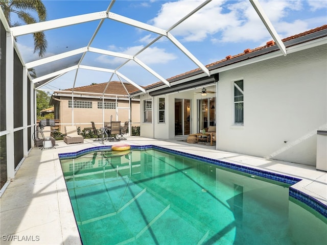 8850 Springwood Ct, Bonita Springs, FL 34135 - outdoor pool with glass enclosure and a patio area