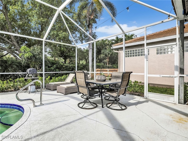 8850 Springwood Ct, Bonita Springs, FL 34135 - unfurnished sunroom with outdoor dining space