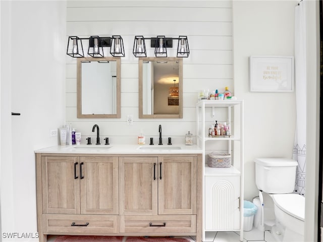 8850 Springwood Ct, Bonita Springs, FL 34135 - full bath featuring double vanity, toilet, and a sink