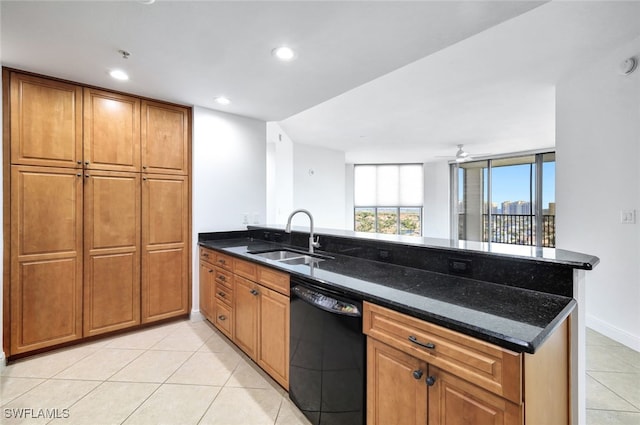 kitchen with light tile patterned floors, sink, dishwasher, kitchen peninsula, and dark stone counters