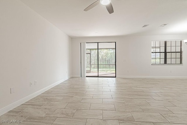 unfurnished room with ceiling fan