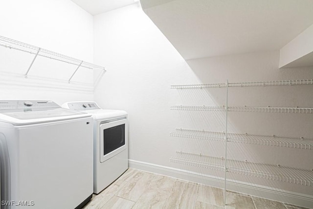 laundry room featuring washer and clothes dryer