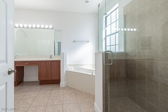 bathroom featuring tile patterned floors, independent shower and bath, and vanity