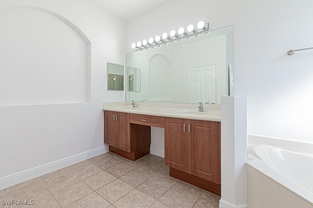 bathroom with vanity, a bath, and tile patterned floors