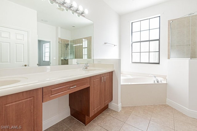 bathroom with a healthy amount of sunlight, independent shower and bath, and tile patterned flooring