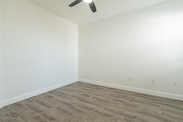 unfurnished room with ceiling fan and wood-type flooring