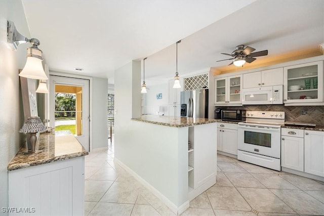 kitchen with pendant lighting, white appliances, glass insert cabinets, and white cabinets