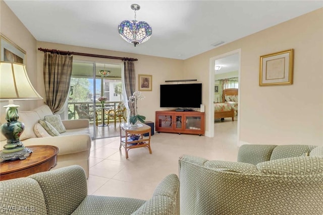 5595 Rattlesnake Hammock Rd Unit C-19, Naples, FL 34113 - living area featuring plenty of natural light and tile patterned flooring