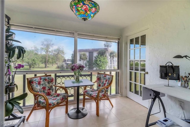 5595 Rattlesnake Hammock Rd Unit C-19, Naples, FL 34113 - sunroom with a textured wall and tile patterned floors