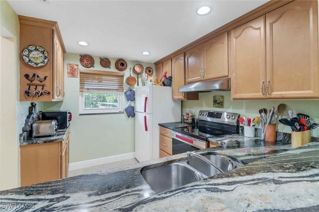 5595 Rattlesnake Hammock Rd Unit C-19, Naples, FL 34113 - kitchen with stainless steel range with electric cooktop, under cabinet range hood, freestanding refrigerator, dark stone countertops, and recessed lighting