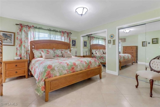 5595 Rattlesnake Hammock Rd Unit C-19, Naples, FL 34113 - bedroom featuring two closets and tile patterned flooring