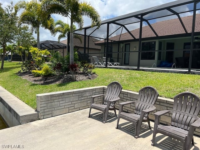 view of patio / terrace with a lanai