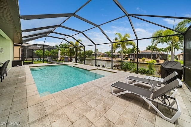 view of swimming pool featuring grilling area, a water view, glass enclosure, and a patio area