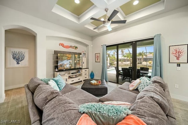 living room featuring beamed ceiling, coffered ceiling, ceiling fan, and light hardwood / wood-style floors