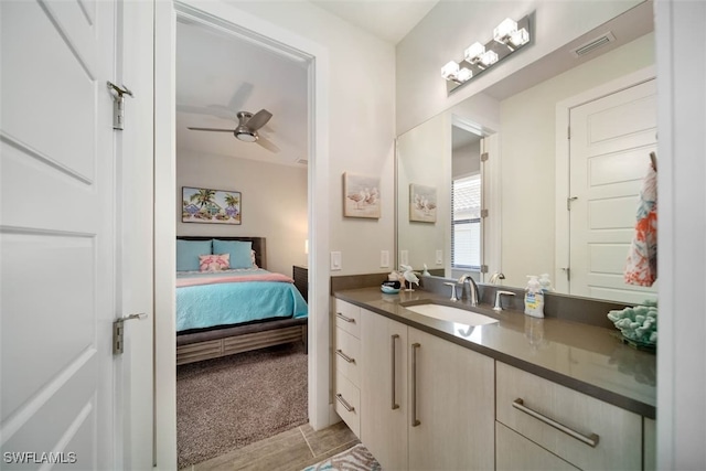 bathroom featuring vanity and ceiling fan