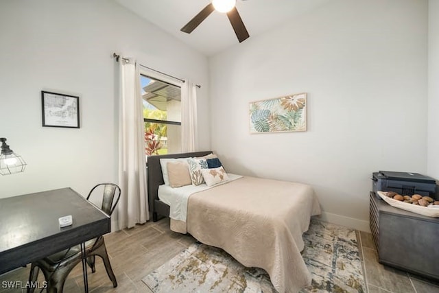 bedroom with lofted ceiling and ceiling fan