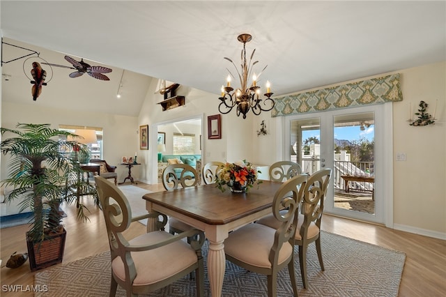 dining area with vaulted ceiling, plenty of natural light, ceiling fan, and light hardwood / wood-style flooring