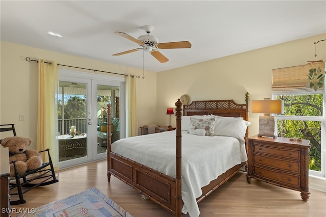 bedroom featuring ceiling fan, access to exterior, light hardwood / wood-style floors, and french doors