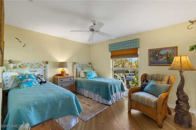 bedroom featuring ceiling fan and wood-type flooring