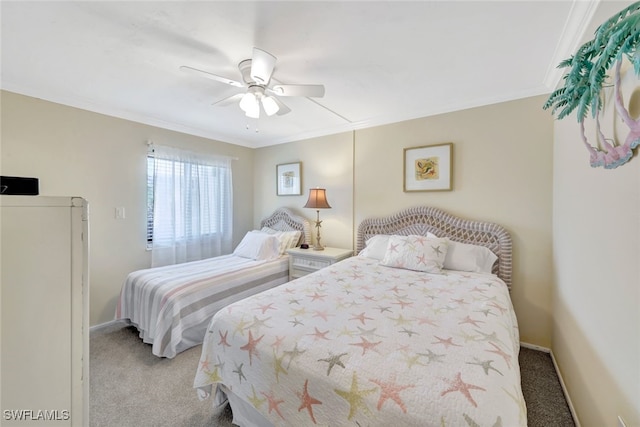 carpeted bedroom featuring crown molding and ceiling fan