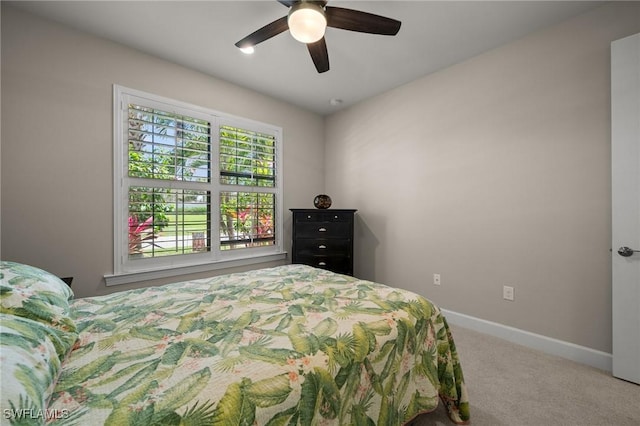 bedroom featuring carpet floors, ceiling fan, and baseboards