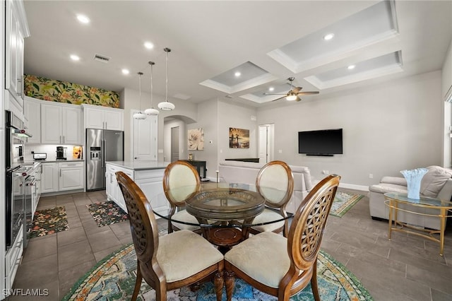 dining room with arched walkways, recessed lighting, coffered ceiling, visible vents, and a ceiling fan