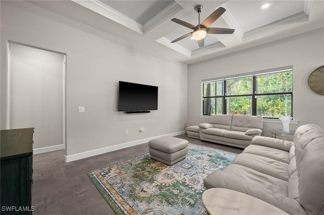 living area with ceiling fan, ornamental molding, coffered ceiling, and baseboards