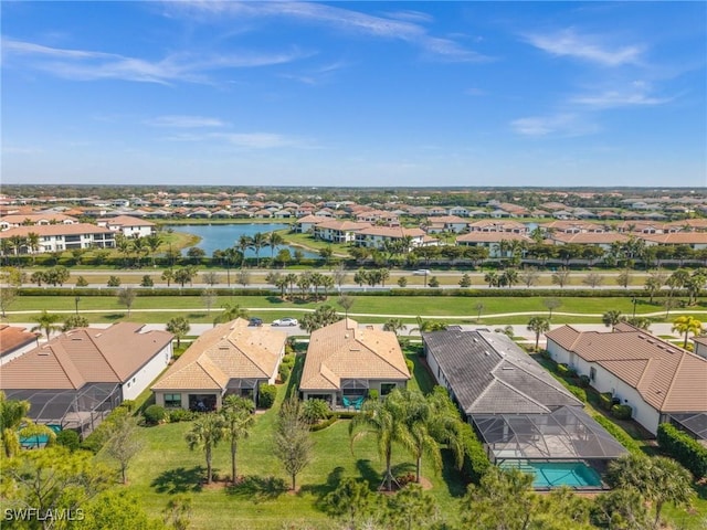 aerial view featuring a water view and a residential view