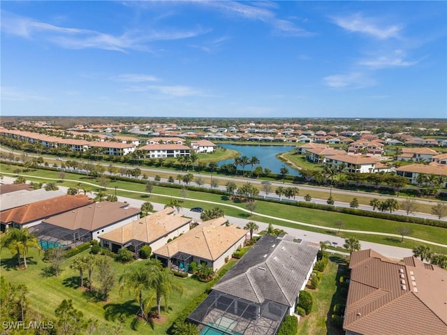 aerial view featuring a residential view and a water view