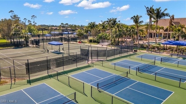 view of sport court featuring fence