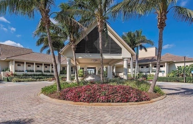 view of building exterior with decorative driveway